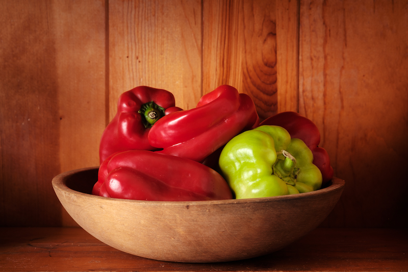 Whole red and green peppers